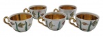 SCHMIDT - 05 xícaras de café adornadas à mão com temática marinha (fundo do mar); interior com douração e uma estrela-do-mar. Em porcelana policromada. Medidas: 8,5 x 4 cm. Não acompanham pires. Douração ligeiramente desvanecida na asa de duas xícaras.