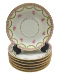 THÉODORE HAVILAND, LIMOGES, FRANCE - 07 pires em porcelana francesa de Limoges, adornados na borda com filete dourado e coloridas guirlandas de folhas e flores. Medidas: 14 cm (diâm.).