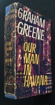 livro - Our Man in Havana an entertainment - Graham Greene - Heinemann - 1958 - 1ª ed. -  idioma inglês - 273 p. - capa dura com sobrecapa danificada pelo tempo - miolo amarelado - (20x13)cm.