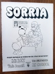 Propaganda Antiga Impressa - Quadrinhos Disney Editora Abril - Década de 1970Descrição: Belíssima página de publicidade institucional original de época da Editora Abril, veiculada na década de 1970. O anúncio traz o título "SORRIA" com uma arte em preto e branco do Pato Donald consultando o futuro com a Margarida, promovendo as revistas em quadrinhos que "são a favor do bom humor" (Mickey, Pato Donald, Tio Patinhas e Zé Carioca). Item autêntico retirado de revista da época, indispensável para colecionadores de gibis antigos e memorabília Disney nacional, perfeito para enquadramento decorativo vintage. Produto em papel (não é cópia ou reprodução).