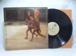 Disco de Vinil LP - `The Rhythm of the Saints`, com Paul Simon, em bom estado. Inclui encarte.