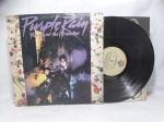 Disco de Vinil LP - `Purple Rain`, com Prince and the Revolution, em bom estado. Inclui encarte.