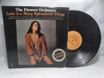 Disco de Vinil LP - `Love Is a Many Splendored Thing`, com The Flowers Orchestra, em bom estado.