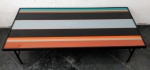 DESIGN - MESA DE FERRO COM TAMPO EM VIDRO COLORIDO, ANOS 60. MEDIDAS: 1,32 M. X 61 CM X 40 CM.