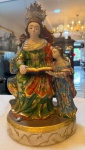 Arte Sacra, Brasil Séc XX. Santa Ana & Nossa Senhora menina. / Santa Ana mestra. Terracota policromada e dourada, resplendor em prata de lei. Mede: 38cm.