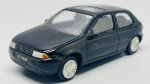 Miniatura em metal  Ford Fiesta  Modeline, escala 1:43, A peça apresenta carroçaria em metal na cor preta, interior detalhado, vidros com teto de abrir e placas decorativas personalizadas "JO 9400". O chassi inferior em metal traz gravadas as especificações de fabrico e escala, acompanhando a caixa original de época com janela expositora. Marcas do tempo e de uso.