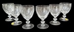 Conjunto com 6 taças para vinho em cristal translúcido lapidado, com rica lapidação geométrica e haste facetada, base circular. Peças marcadas Lead Crystal 24% PbO  Handmade, com gravação Strauss. Elegantes e de ótima transparência, ideais para serviço refinado. Mede 11,5 cm.