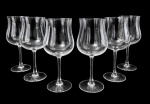 FRANÇA - Conjunto com 6 imponentes taças em cristal translúcido francês, bojo em formato tulipa e haste lisa. Peças elegantes, ideais para vinho ou água. Possuem selo na base. Em bom estado de conservação. Medem 22,5 cm de altura.