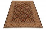 Tapete persa Kerman (Kerman Soumak), confeccionado à mão em lã, decorado com rica padronagem floral policromada sobre fundo marrom, com franjas. Etiqueta de origem iraniana. Perfeito estado. Medidas: 3,00 x 2,00.