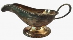 Molheira em metal espessurado a prata com borda trabalhada. Medidas: Altura 10 cm, Largura 9 cm e Comprimento 20 cm.