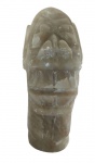 Escultura em pedra feita manualmente representando uma carranca. Medidas: Altura 16 cm, Largura 6 cm e Comprimento 5 cm. 