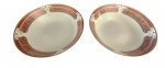 PORCELANA SCHMIDT - Par de saladeiras em porcelana com pintura em tema de guirlanda na tonalidade salmão com bordas e dourado. Medida: Altura 10 cm e Diâmetro 25 cm.