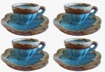 Lote com quatro xícaras para café em porcelana pintado artesanalmente na tonalidade azul e bege. Medida: altura 5 cm diâmetro 6 cm.