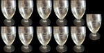 Lote com onze taças para vinho branco em vidro com lapidação em baixo relevo em tema de folhas. Medida: altura 12 cm diâmetro 7 cm. 