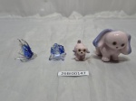 Lote de 4 bibelots na forma de animais em vidro, porcelana. Medindo o maior 5cm de altura.