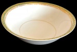 BRENNAND. Saladeira em porcelana nacional esmaltada na cor branca, decorada com faixa verde e rica ornamentação em ouro, composta por frisos e motivos fitomorfos. Manufatura marcada no verso, medidas: 7 x 25,5 cm.