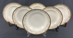 IVORY CHINA BY PORCELANA SCHMIDT BRASIL, Roberto Simões. Conjunto de 6 pratos fundos em porcelana marfim esmaltada, com faixa decorativa policromada de motivos florais e arabescos, emoldurada por largas bordas douradas. Manufatura e assinatura identificadas no verso. Medindo: 4 x 23 cm.