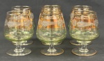 Seis taças em demi-cristal com rica lapidação floral e de folhagens com frisos em ouro. Medidas: 10 x 6 cm.