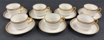 LIMOGES P.L., FRANÇA. Seis xícaras para chá em porcelana branca, em estilo Art Déco, Peças de corpos facetados, com alças geométricas e decoração em frisos dourados. Marca do fabricante na base.