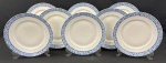 EPIAG, Tchecoslováquia. Oito pratos rasos em porcelana tcheca esmalatda na cor branca, decoração em azul floral. Manufatura no verso. Medindo: 24 cm.
