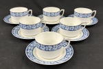 EPIAG, Tchecoslováquia. Seis xícaras para chá em porcelana tcheca esmalatda na cor branca, decoração em azul floral. Manufatura no verso. 1 pires com bicado.