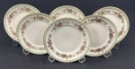 Schmidt, Ivory China - Seis pratos para sobremesa em porcelana na cor marfim, esmaltado com policromia de flores, listra verde e filete dourado. Medindo: 19 cm.