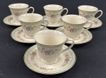 Schmidt, Ivory China - Seis xicaras para chá em porcelana na cor marfim, esmaltado com policromia de flores, listra verde e filete dourado.