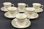 Schmidt, Ivory China - Seis xicaras para café em porcelana na cor marfim, esmaltado com policromia de flores, listra verde e filete dourado.