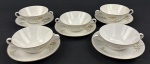 Rosenthal, Germany. Cinco xícaras para consommé em porcelana alemã esmaltada na cor branca delicados ramos floridos e folhagens, finalizados por fino filetes em ouro. Manufatura no verso.
