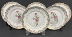 REAL, São Paulo. Seis pratos rasos em porcelana de ótima qualidade e manufatura nacional, adornadas por ricos filetes à ouro e motivos florais. Manufatura no verso. Medindo: 24 cm.
