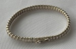 Pulseira feminina em prata de lei, confeccionada em corrente de malha mole. Peso: 8,4 g.