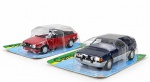 COLECIONISMO, duas (2) miniaturas de automóveis, em metal e material sintético, sendo: A) um (1) Ford Escort XR3 Conversível, 1982, na cor vermelha, medindo 11cm e B) um (1) Volkswagen Gol GTI, 1988, na cor azul-escuro, medindo 11,5cm. Ambas com detalhes realistas de carroceria, rodas e acabamentos, acondicionadas em suas embalagens originais tipo blister.