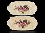 FAIANÇA / SYLVA CERAMICS - (2) Travessas confeccionadas em faiança vitrificada na tonalidade creme , apresentando trama tipo cesto em relevo e detalhe floral ao centro pintado à mão , medida : 30 x 15 cm