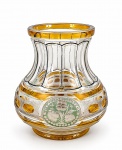 CRISTAL DOUBLE, um (1) vaso confeccionado em cristal double na tonalidade amarela, lapidado em caneluras, elementos geométricos, pingos de diamante e elementos florais na tonalidade verde, realces em ouro com falhas na douração, medindo 14x9cm.