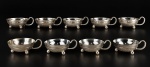 METAL PRATEADO, nove (9) taças para sobremesa confeccionadas em metal espessurado a prata da manufatura EBERLE, cinzelada por elementos florais e vegetalistas com moldura perolada, alça vazada, apoiada sobre 3 pés em bola, banho no estado, medindo 4x12x9cm.
