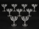 CRISTAL, conjunto composto por nove (9) taças para champanhe/ sobremesa , em cristal translúcido, modelo coupe, apresentando bojos largos e rasos, ricamente trabalhados com lapidação geométrica em losangos e motivos folháceos, hastes torneadas e bases circulares, medida : 12 x 8,5 cm , 1 apresenta bicado .
