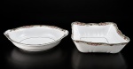 Sociedade de Porcelana de Coimbra (S.P. Coimbra), duas (2) peças, sendo: A) 1 travessa oval e funda, medindo 7x30x21cm e B) 1 tigela, medindo 8,5x24x24cm, confeccionados em porcelana portuguesa na tonalidade branca, ricamente decorada por guirlanda floral, vegetalista e geométrica em policromia com filetes na cor verde.