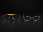 DIVERSOS, duas (2) armações para óculos confeccionadas em metal dourado de modelos distintos, sendo a segunda da foto da manufatura RAY-BAN, modelo RG 3548-N em excelente estado de conservação, primeira com sinais de oxidação e uso, medindo 5,5x13,5x14cm e Ray-Ban 4x12,5x11,5cm.
