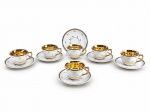 PORCELANA MONTE ALEGRE, seis (6) xícaras para chá com seus respectivos pires confeccionadas em porcelana na tonalidade branca, decorado por folhagens, filetes em ouro e faixa na tonalidade marrom, interior em vasta douração, apresentando leves falhas na douração, medindo 6x10x9cm.