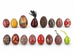 DIVERSOS, dezesseis (16) ovos decorativos confeccionados em madeira de modelos, tamanhos e decorações distintas, maior medindo 9cm e menor 4cm em material sintético.