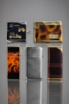 DIVERSOS, cinco (5) isqueiros de modelos, tamanhos, decorações e materiais distintos, sendo 1 da manufatura PRINCE BUNNY, 1 da manufatura APOLLO-K, 1 da manufatura SUPER-TIN, 1 da manufatura ZIPPO e 1 da GUCCI, sinais de uso, necessitam reparos, vendidos no estado da foto.