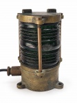 NÁUTICA, um (1) antigo sinalizador naval, com corpo em vidro verde canelado e estrutura metálica em bronze, adaptado para luminária elétrica. Medida : 19 x11 cm , apresenta tricandos e rachados .