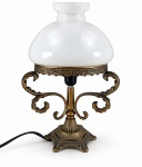 ABAJUR - Abajur para uma lâmpada em bronze dourado , com base ornamentada em relevo, braços laterais trabalhados em volutas e folhagens, cúpula em vidro opalinado branco , medida do abajur : 19 x 18 cm , medida total : 33 cm , fiação no estado .