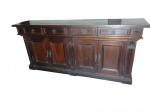 GRANDE BUFFET APARADOR EM MADEIRA NOBRE 4 portas almofadadas e 4   gavetas  ornamentado com ferragens em metal  recortadas de inspiração ibérica/colonial. Medidas: 2,16 x 0,48 x 0,95 m .(Apresenta leves marcas de uso e do tempo).Retirada com agendamento na Barra da Tijuca