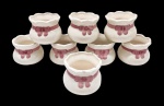 Conjunto com 8 mini cachepôs em porcelana pintada a mão - 05x07 cm - com descascados na bordas.