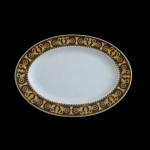 PAUL WUNDERLICH (German 1927-2010) For VERSACE. Modelo  Barocco. Manufatura by Rosenthal - Travessa de formato oval em porcelana alemã  Marca da manufatura no verso das peças. 34 x 25 cm.