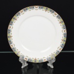 PORCELANA FRANCESA, uma (1) fruteira de pé baixo, borda ornada com barrado em policromia representando borboletas e flores, marca LIMOGES - U. C. (Union Ceramic)  FRANCE, ANDRIEUX & Co., arremates a ouro, medindo 23 cm diâmetro e 5 cm altura, vide foto.