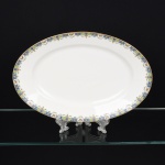 PORCELANA FRANCESA, uma (1) travessa oval, borda ornada com barrado em policromia representando borboletas e flores, marca LIMOGES - U. C. (Union Ceramic)  FRANCE, ANDRIEUX & Co., arremates a ouro, medindo 39,5 x 27 cm, vide foto.