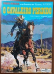 HQ Rara: Tenente Blueberry  O Cavaleiro Perdido (Charlier / Giraud)  Ed. Meribérica/Liber"O Cavaleiro Perdido" (Le Cavalier Perdu) é um dos episódios fundamentais que consolidaram Blueberry como a maior referência de faroeste nos quadrinhos mundiais. Ambientado logo após os eventos de Forte Navajo e Tempestade no Oeste, este álbum traz o Tenente Blueberry cruzando o deserto em uma missão desesperada para evitar uma guerra sangrenta com os Apaches. O traço detalhista e dinâmico de Jean Giraud dita o ritmo impecável desta narrativa realista e madura. Fora de catálogo há décadas e impresso com a excelente qualidade gráfica da extinta Meribérica/Liber, é uma peça indispensável para colecionadores.