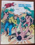 Raríssimo: Tex Nº 164  Selva Cruel (1983)  Editora Vecchi (ÚLTIMO NÚMERO DA VECCHI)Este exemplar é uma das edições mais emblemáticas de toda a trajetória de Tex Willer na América Latina. O número 164 marca o fim definitivo da Era Vecchi, a editora pioneira que apresentou o ranger aos leitores brasileiros em 1971. Devido à iminente falência da empresa na época, a tiragem desta edição foi drasticamente cortada, distribuída de forma incompleta nas bancas e recolhida às pressas, o que a transformou instantaneamente em um item escasso. Uma peça de museu para colecionadores de quadrinhos bonellianos e investidores da nona arte, fundamental para fechar a cronologia da primeira edição